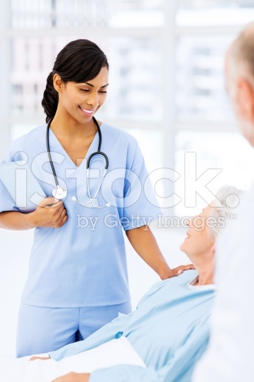 stock-photo-41411082-nurse-consoling-female-patient-in-hospital-ward-1